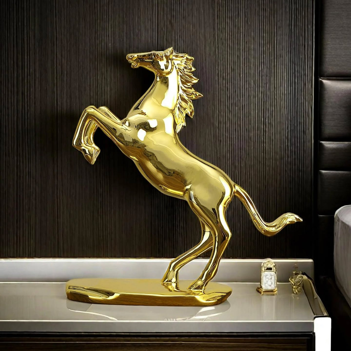 Dawood Lifestyle & Gadgets kes golden rearing horse statue with mirror gold finish, detailed flowing mane and tail, mounted on an oval base for luxury home and office décor.