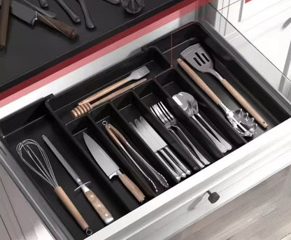 Expandable hard plastic cutlery drawer organizer in grey, black, or white