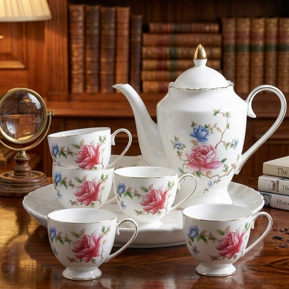 Porcelain tea set with rose pattern including teapot, 6 cups, and rotating tray for elegant tea serving. 