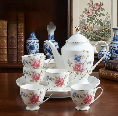 Porcelain tea set with rose pattern including teapot cups and rotating tray