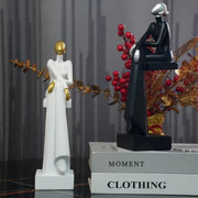 women Sitting sculpture