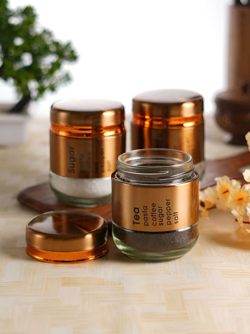 Three 450ml glass canisters with stylish metal covering for kitchen storage