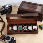 Black 6-slot PU leather watch organizer box for storing and protecting watches.