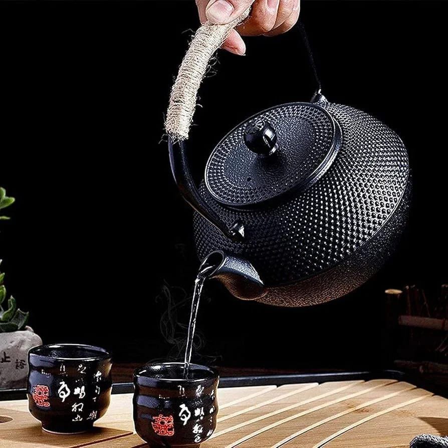 900 ml Japanese style black cast iron teapot with stainless steel infuser and enamel coated interior for loose leaf tea and teabags.