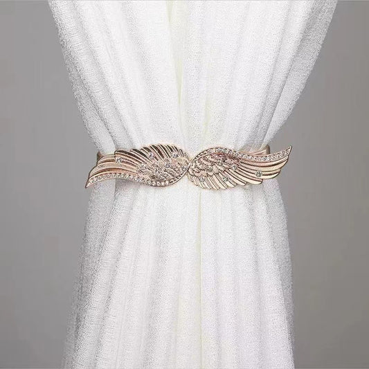 Metal spring curtain buckle holders in a modern design.