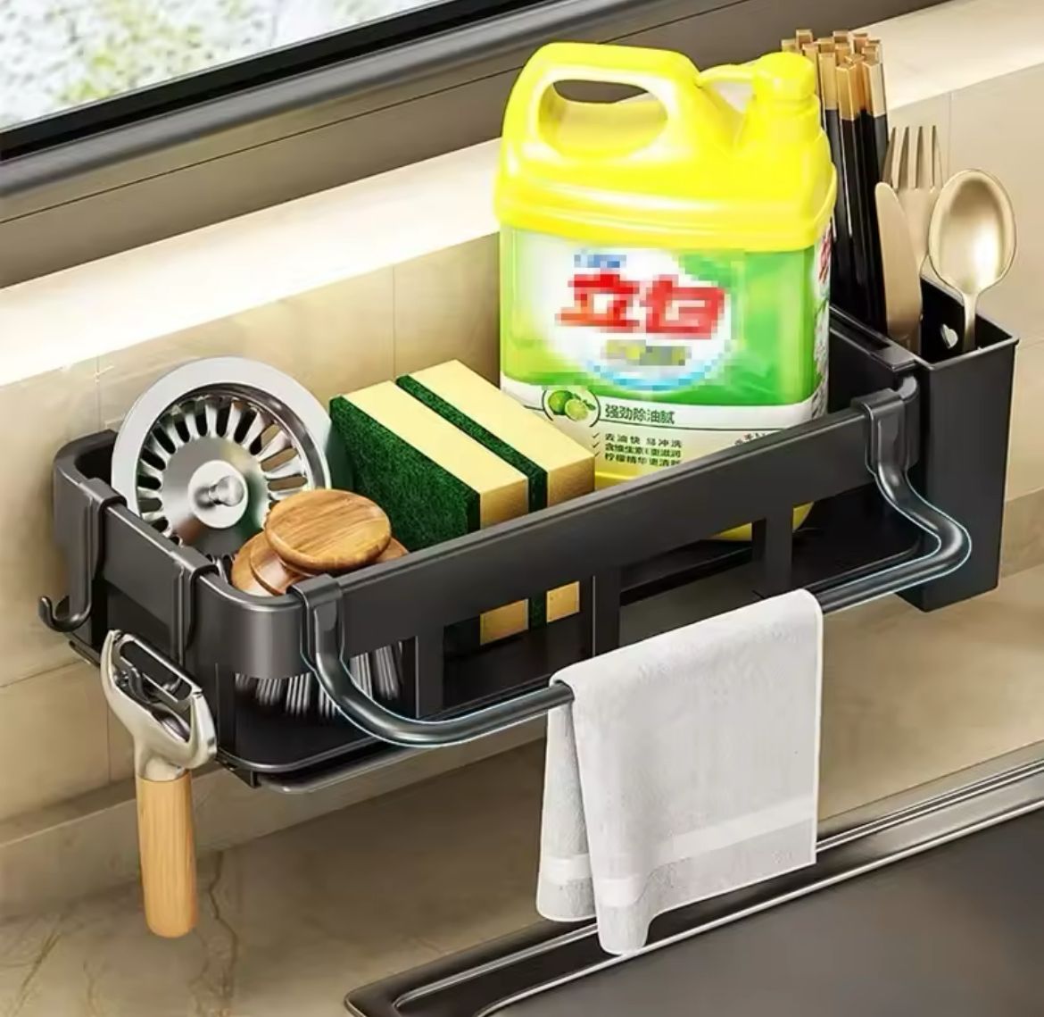 Kitchen sink drain rack with sponge holder, cutlery cup, and drain tray.