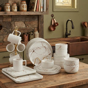 36 piece white floral ceramic dinner set with dinner plates, side plates, bowls, cups, saucers, and plate bowls.