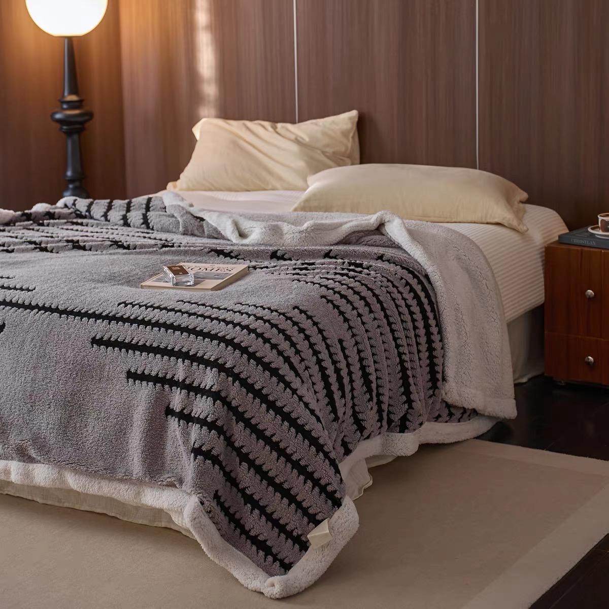 Soft and plush Sherpa blanket for warmth and comfort.