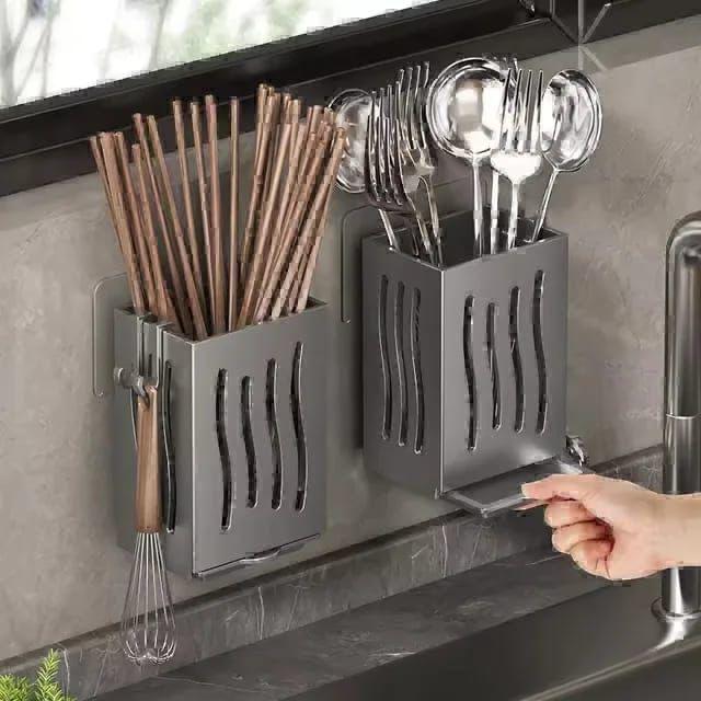 Wall mounted perforated plastic utensil holder with adhesive stickers in grey or cream white.