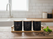 Black ceramic canister set with bamboo stand, three 800 ml jars for kitchen storage.