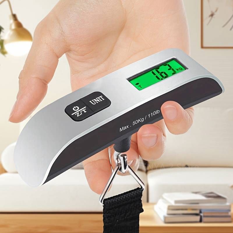 Portable digital luggage scale in silver, high accuracy up to 50 kg with LCD display for travel use.