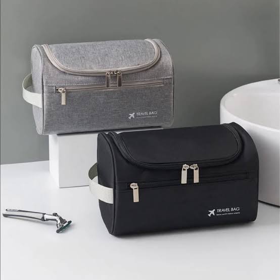 Hanging toiletry bag with built in hook spacious travel organiser for toiletries cosmetics grooming products and travel accessories.