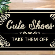 Non-slip black doormat with cream-colored message, suitable for indoor and outdoor use, size 50×80 cm