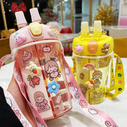 Two cartoon-themed water bottles with colorful designs on a table.