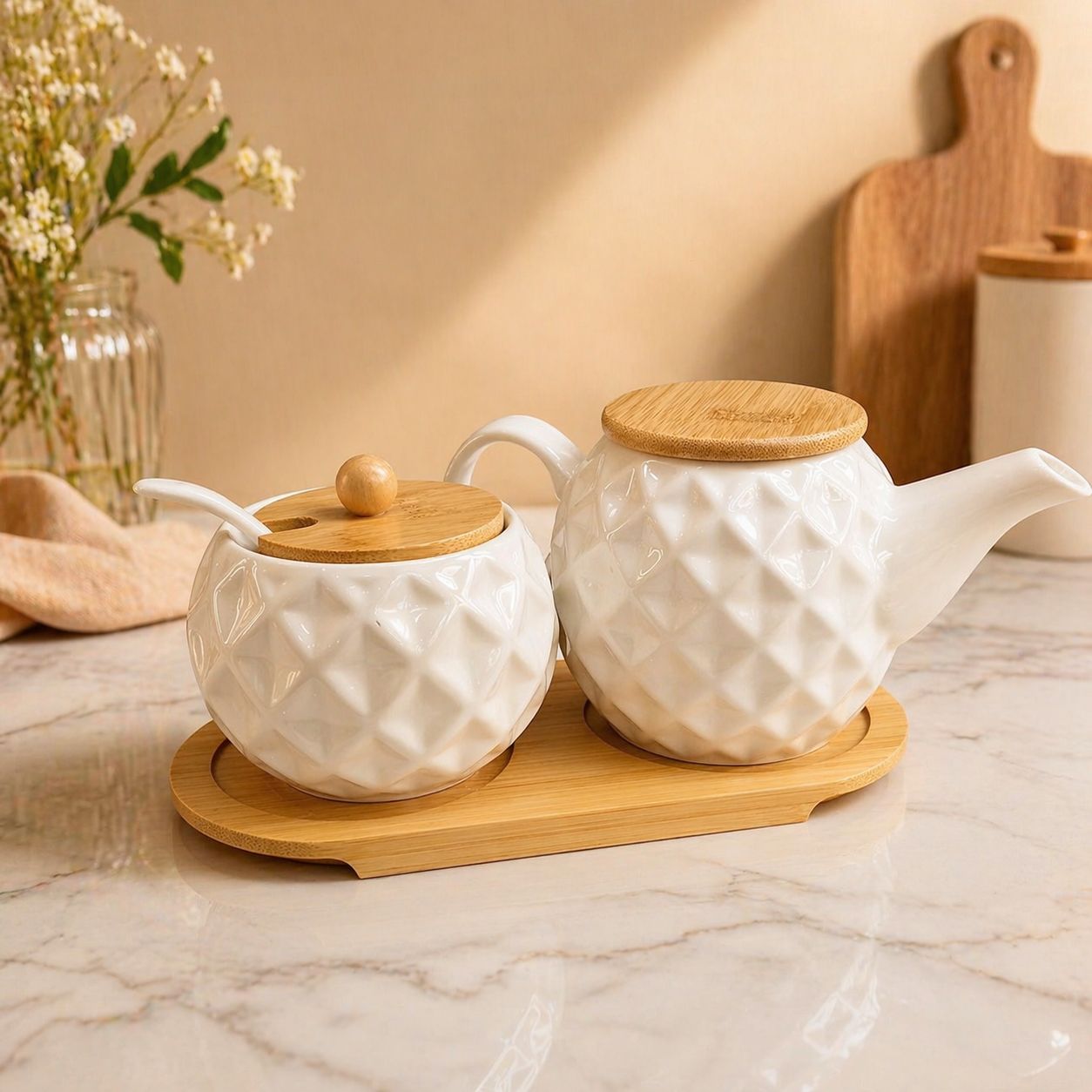3 Piece ceramic tea set with kettle and sugar dish featuring wooden lids for elegant tea serving