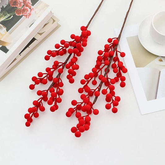 Five artificial long berry stems measuring forty three centimetres.