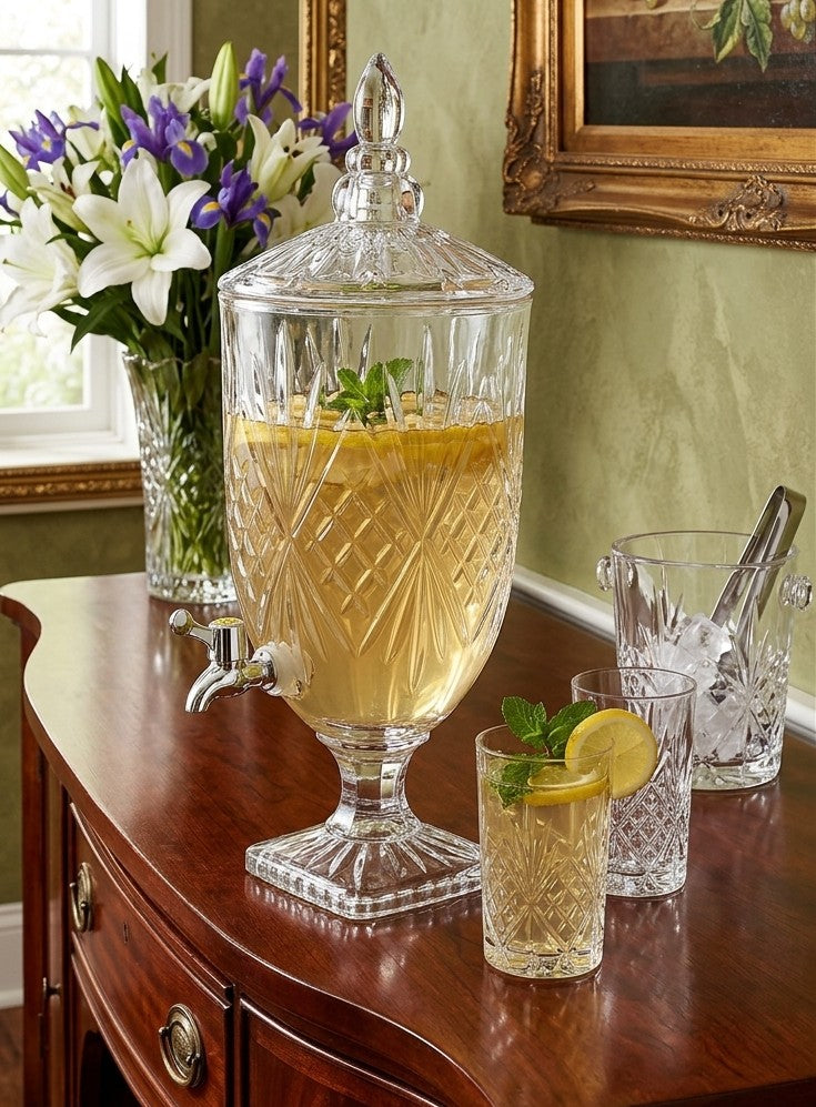 Transparent glass beverage dispenser available in 3L and 5L capacities for serving drinks. 