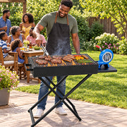Portable folding charcoal BBQ grill with manual air blower, metal body and X stand