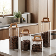 4 Piece airtight glass jars with wooden lids for stylish kitchen pantry and countertop food storage