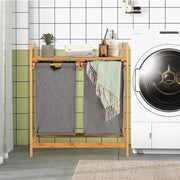Bamboo twin partition laundry organizer with pull-out bags and storage shelf for home laundry organization