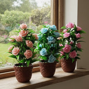 artificial plastic rose flower potted plant for home or office décor