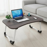 Foldable portable laptop desk with tablet and drink slots for studying, working, and home use.