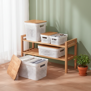 Large 17-litre storage basket with a bamboo lid for stylish home organization in bathrooms, kitchens, and laundry rooms.