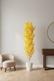 Tall artificial cherry blossom arrangement with pot and toppings.