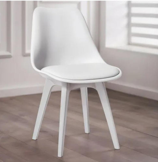 Modern dining chair with padded plastic seat and solid beech wood legs.