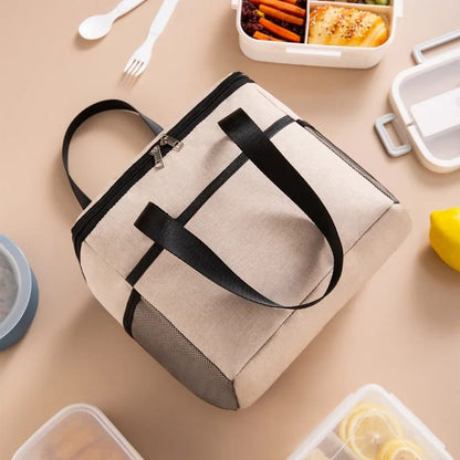 Large insulated lunch bag with adjustable shoulder strap and leakproof interior.