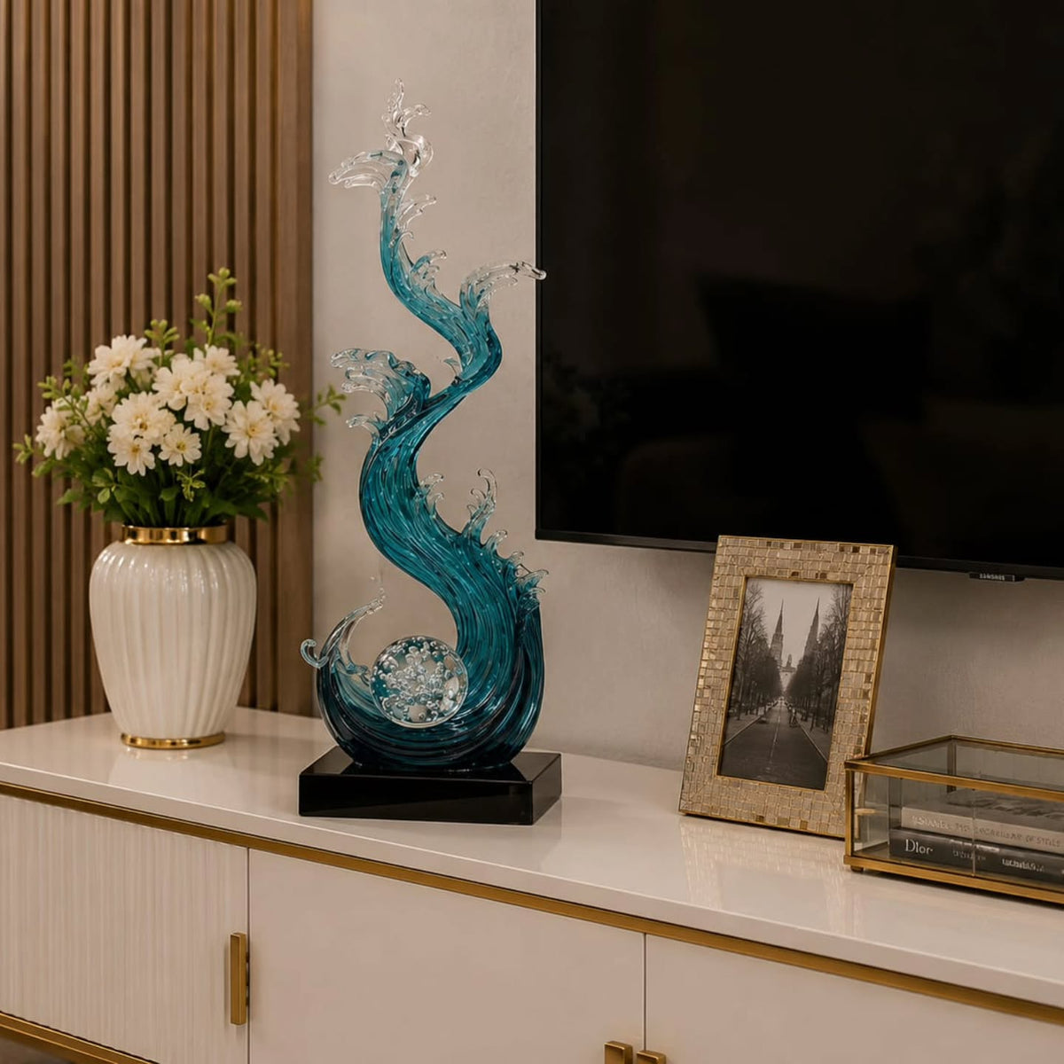 Dawood Lifestyle & Gadgets kes 75cm ocean wave resin sculpture featuring flowing blue and clear translucent waves spiralling around a crystal ball on a black display base.