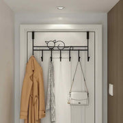 Iron over-the-door hanger with 7 hooks for hanging coats, bags, clothes, and accessories, available in black and white.