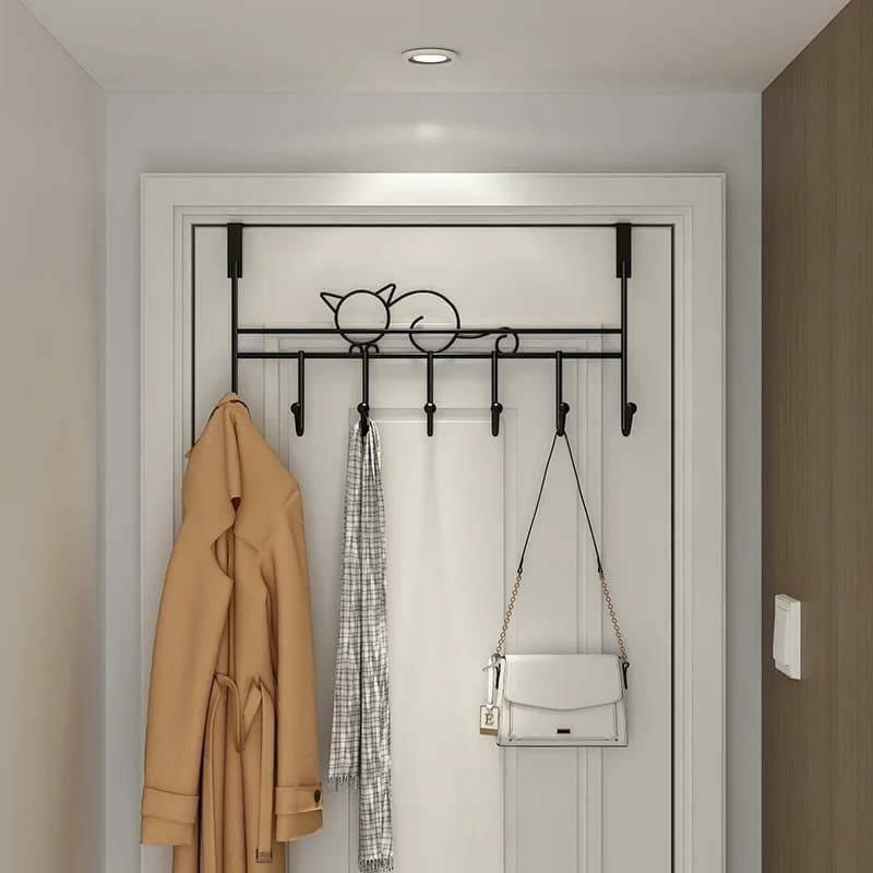 Iron over-the-door hanger with 7 hooks for hanging coats, bags, clothes, and accessories, available in black and white.