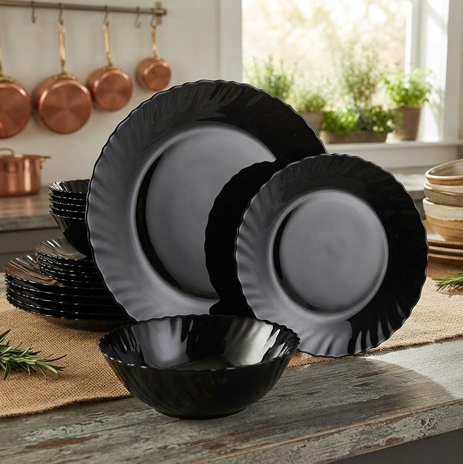 18 piece black plain round dinnerware set with 5 inch soup bowls, 8 inch side plates, and 10 inch dinner plates.