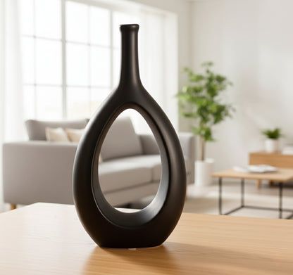 Nordic doughnut vase in long cork shape made of concrete and ceramic.