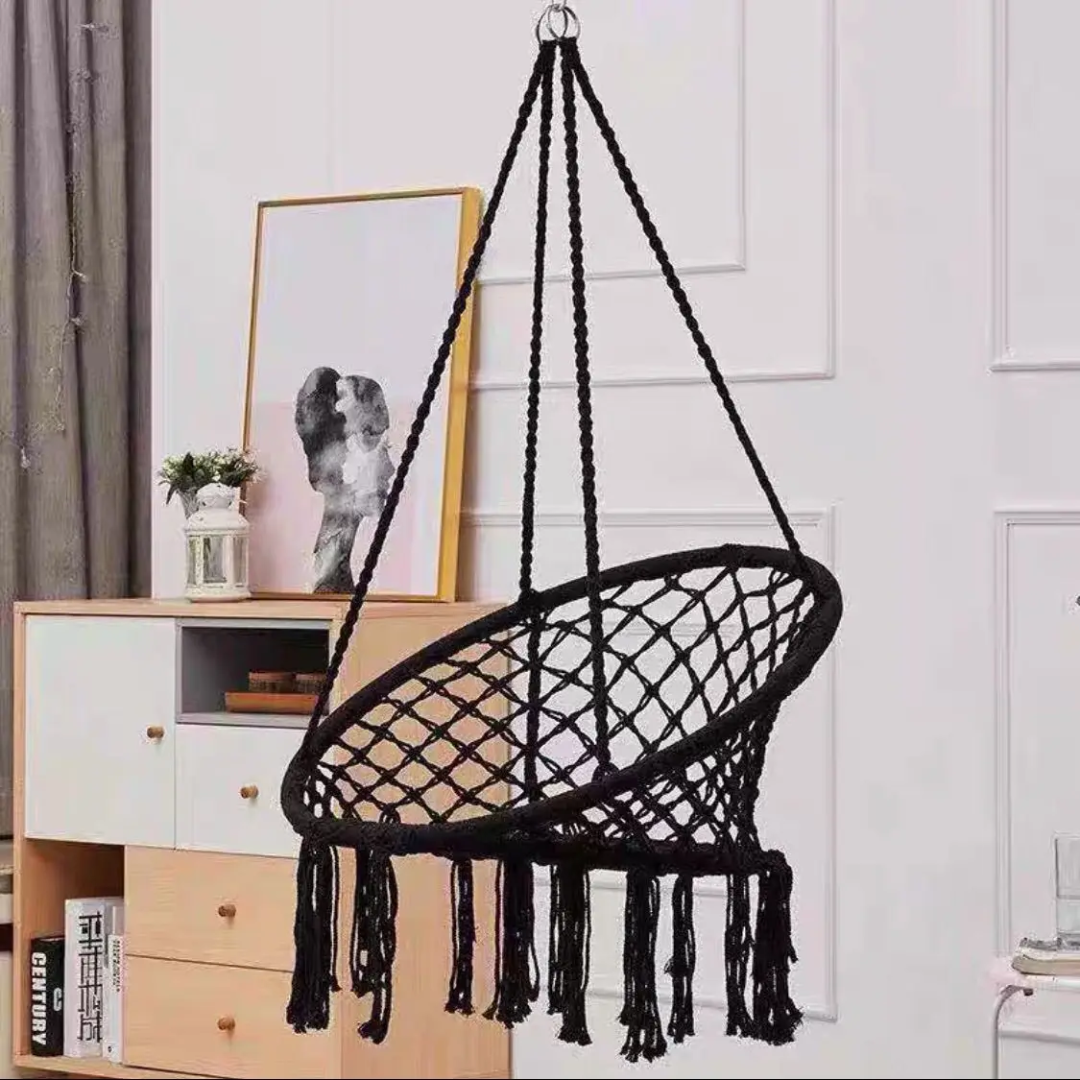 Handcrafted macrame hammock swing chair for indoor and outdoor use, bohemian style comfortable seating. 
