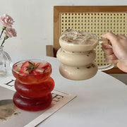 High borosilicate glass cup with handle, heat resistant and suitable for hot and cold beverages.