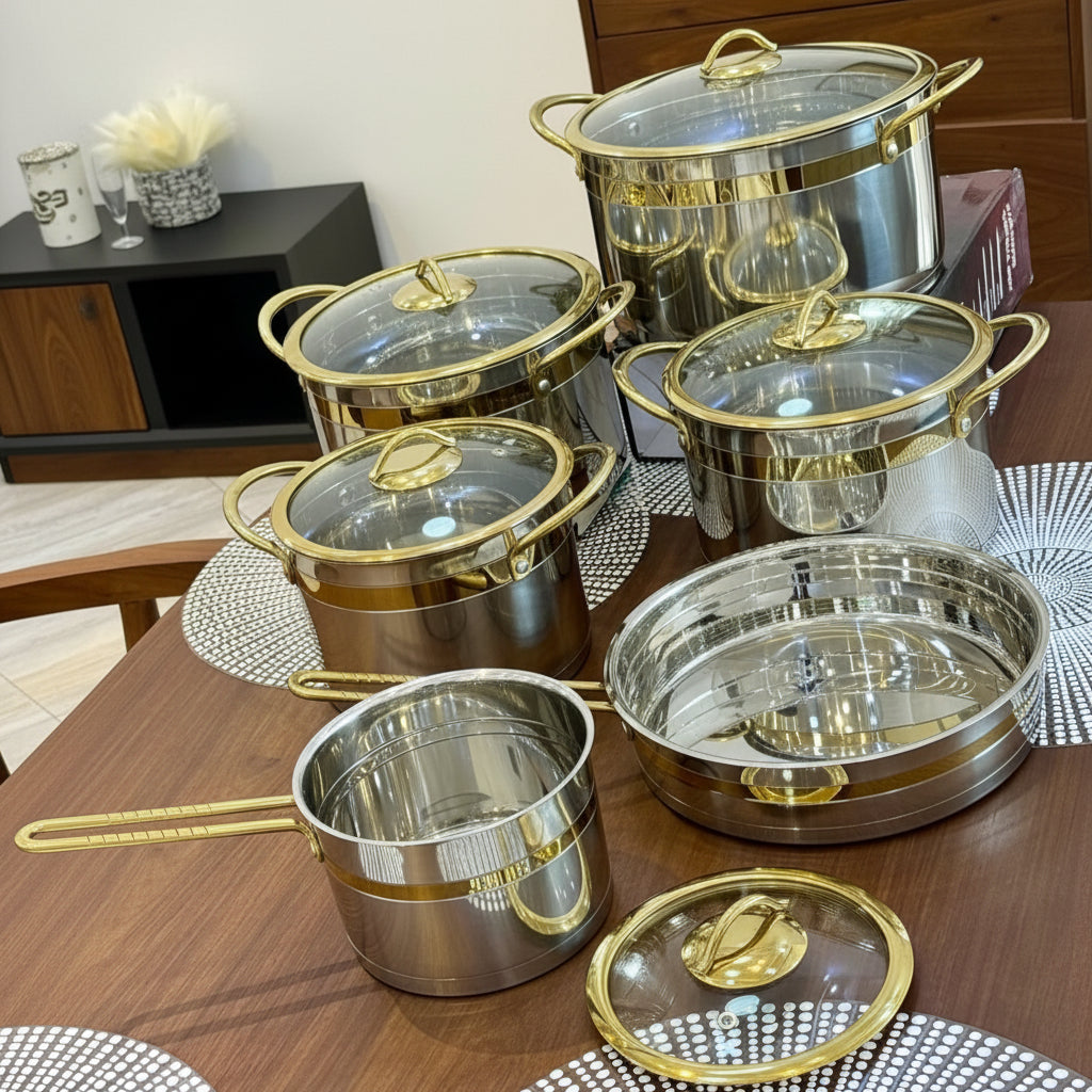 11 piece stainless steel cookware set with tempered glass lids and gold trim, featuring casseroles from 1.6 L to 7 L.