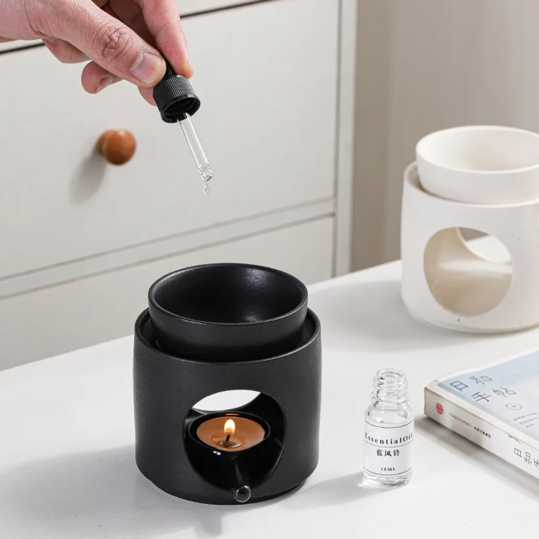 Ceramic essential oil burner with matte black finish and cutout design, aromatherapy diffuser for wax melts and tealight candles