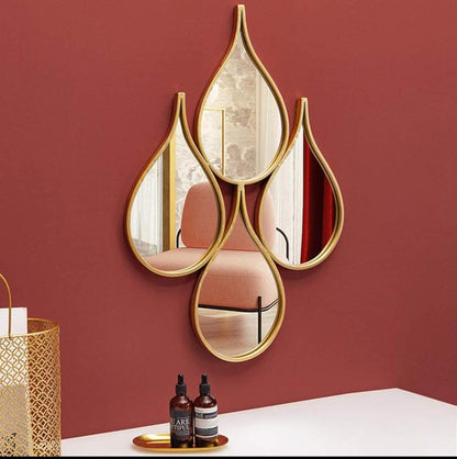 Nordic teardrop-shaped decorative wall mirror with a metal frame for living room or dining room décor.