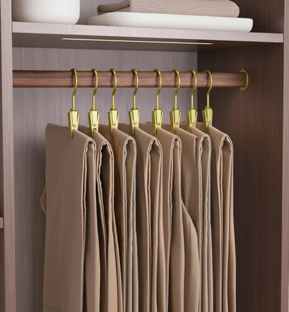 Set of 5 metallic trouser hangers for wrinkle-free garment organization.
