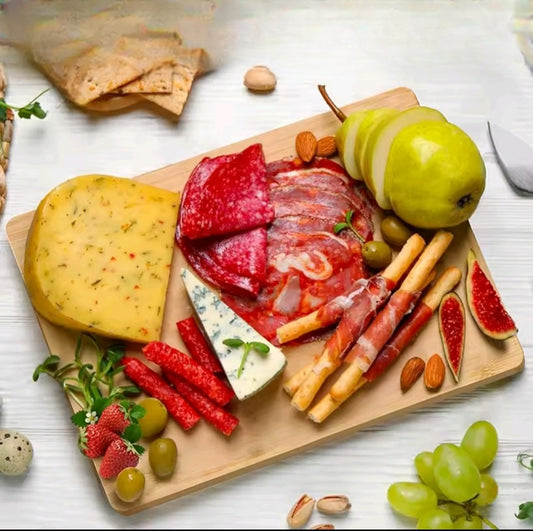 Heavy duty bamboo chopping board with handle for kitchen use.