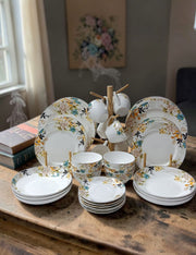 36-Piece white flowered ceramic dinner set with plates bowls cups and saucers