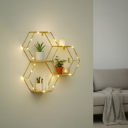 Modern wall-mounted floating shelf with built-in LED lighting for stylish storage and decorative display.