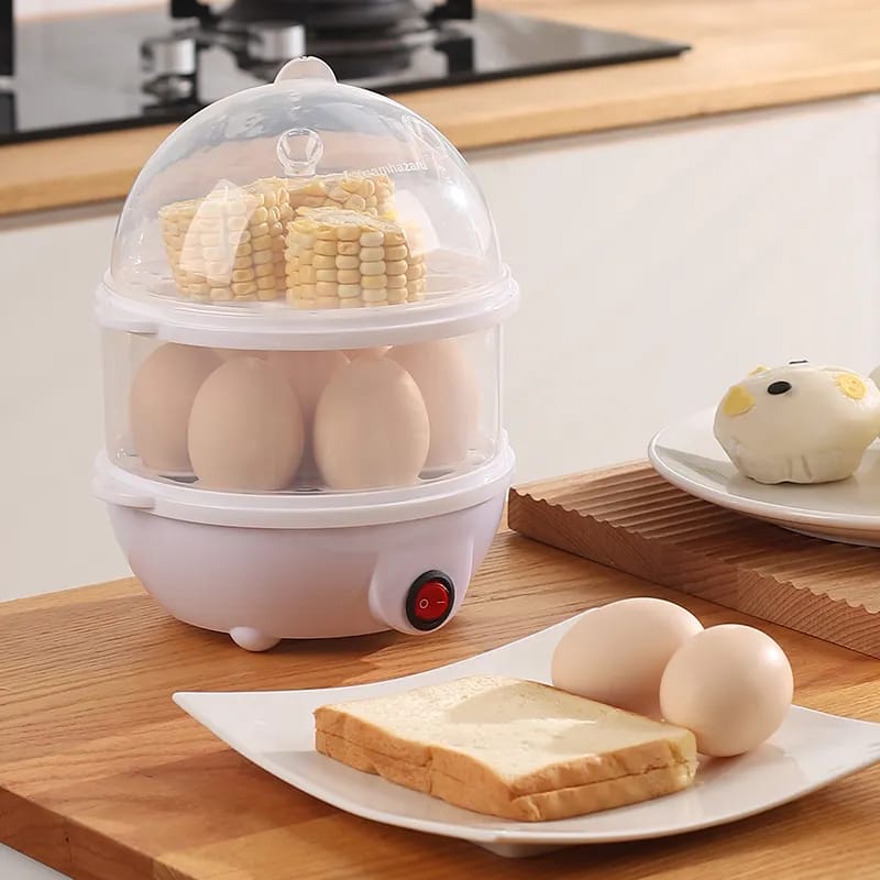 Electric double-layer egg boiler with transparent lid and stacked trays.