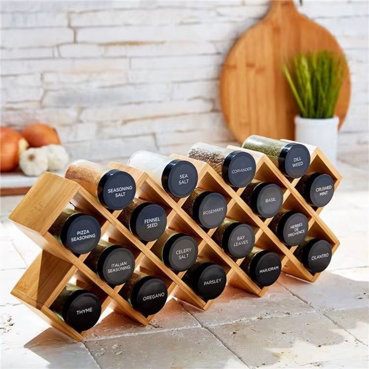 Wooden spice rack with 18 labeled glass jars for organized kitchen spice storage