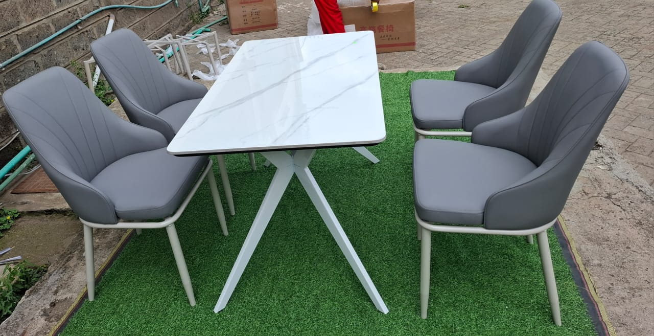 4 Seater Dining Set with White Marble-effect Table and Grey upholstered Chairs.