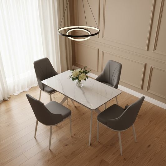 4 seater dining set with white marble-effect table and grey upholstered chairs.