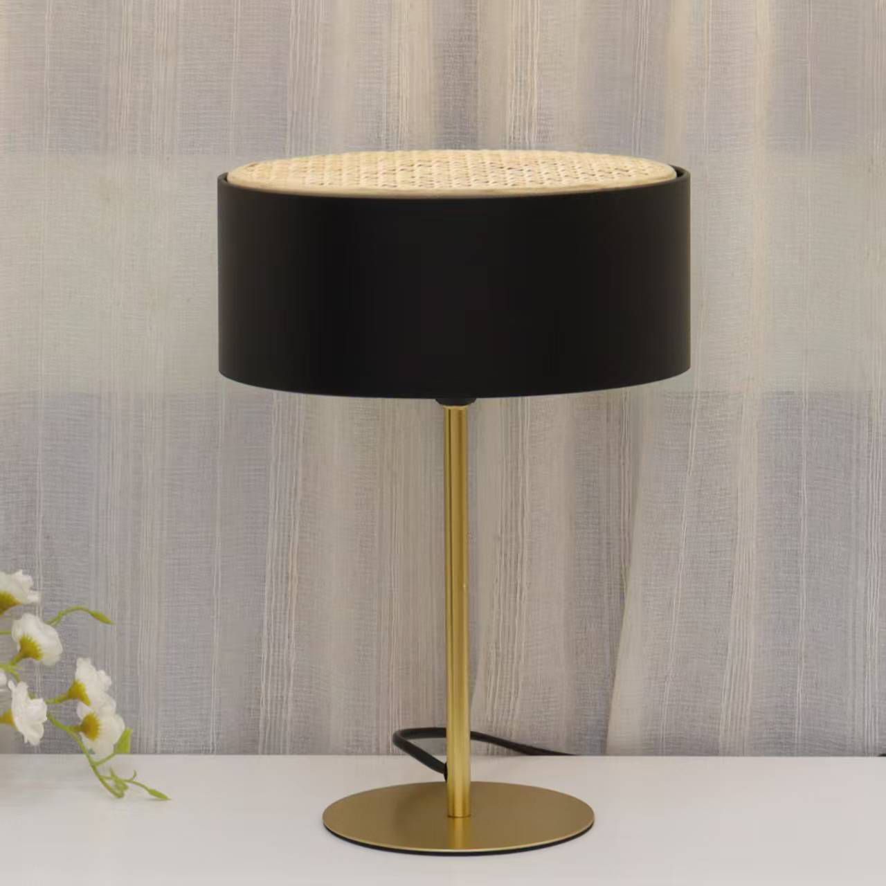 Modern gold table lamp with fabric shade available in white, cream, and black