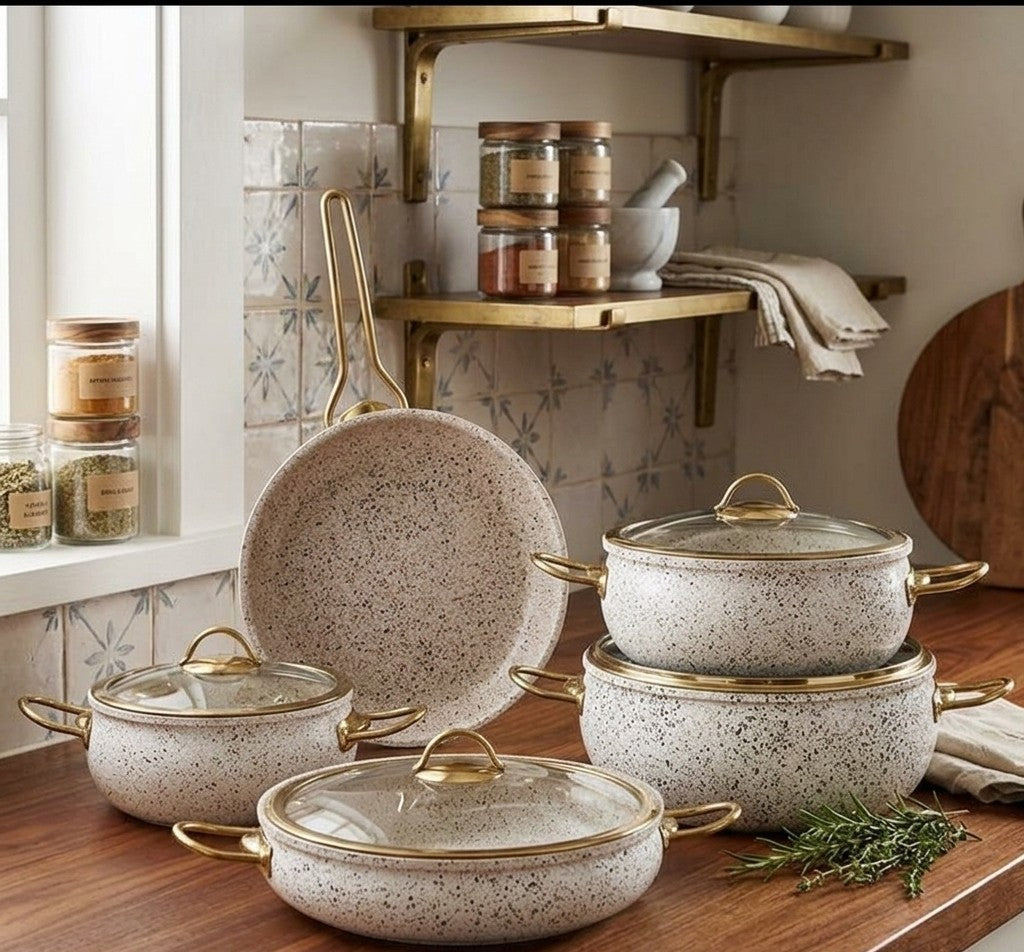 9-piece granite marble-coated non-stick cookware set with stainless steel handles and gold accents, including casseroles and a frying pan.